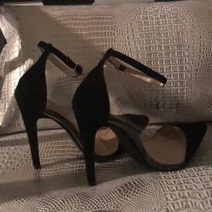 Black and clear pumps